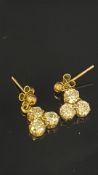 Pair of 9ct gold earrings set with white stones
