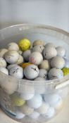 Bucket of mixed golf balls