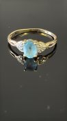 9ct Gold ring set with aquamarine & chip diamond W