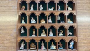 Collection of Wade Whimsies porcelain miniatures in display case