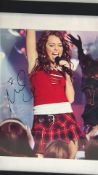 Miley Cyrus signed concert photograph with AFTAL COA, 2009