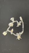 Silver charm bracelet Total weight 22ct