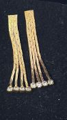 Pair of 9ct gold earrings set with white stones We