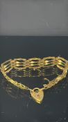 9ct Gold gate bracelet with heart shaped locket, s