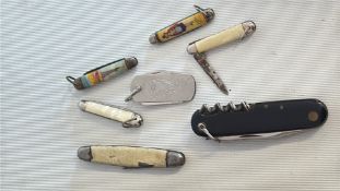 Set of 7 pocket knives, including souvenir celluloid-handled mini penknives, a rectangular Irish