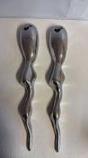 Pair of sculptural polished aluminium door pulls