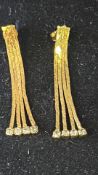 Pair of 9ct gold earrings set with white stones We