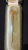 18ct gold pin brooch with central diamond, 9ct gold pin and original box