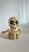 Cast iron skeleton money box