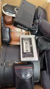 Box of vintage electronics and accessory cases