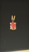 9ct Gold pendant set with red stone