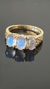 9ct Gold ring set with four oval cabochon moonston
