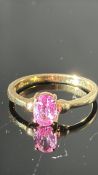 18ct yellow gold ring claw-set with an oval hot pink sapphire, approximately 0.62 ct, certificate