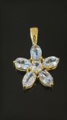 9ct Gold floral pendant set with clear stones Weig