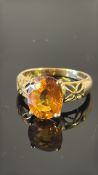 18K yellow gold ring, claw-set with an oval 4.12 ct Royal Chanthaburi orange sapphire (≈11 × 9 mm)