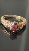 9ct Gold ring set with garnet Weight 2.7g