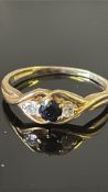 9ct Gold ring set with sapphire & 2 cz's Size S We