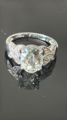 9ct White gold ring set with diamond & oval gem st