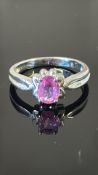 18K white gold ring with petal-form gallery centring an oval hot pink Sri Lankan sapphire approx 0.