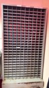 Industrial steel pigeon-hole cabinet on castors, stands at 1.9m