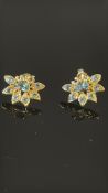 Pair of 9ct gold earring set with green gemstones