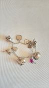 Silver charm bracelet set with 9 charms -52g