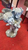 Cast stone figural garden ornament