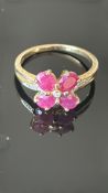 9ct Gold ring set with 4 garnets & small diamonds