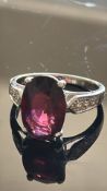 9ct White Gold ring set with oval red stone Weight