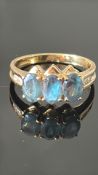 18k yellow gold ring set with three oval Russian alexandrites (approx. 1.39 ct total) flanked by