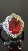 18ct white gold ring centring an oval Madagascar padparadscha sapphire of c.2.17 ct, claw-set within