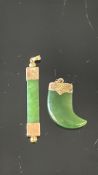 2x Yellow metal pendants set with possible jade