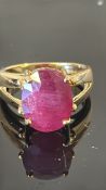18k yellow-gold ring with a 13 x 10.5 mm oval ruby, approx. 6.90 ct, claw-set in a split-shoulder