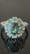 18ct white gold cluster ring set with an 8.5×6.5 mm oval Russian alexandrite (approx.1.41 ct) within