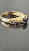 9ct Gold ring set with dark sapphire Weight 2.6g