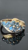 9ct Gold ring set with green stones Weight 3.1g