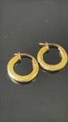 Pair of 9ct gold hoop earrings Weight 1.2g