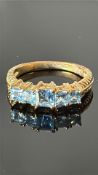 9ct Gold ring set with 5 blue topaz Weight 2.8g