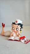 Betty Boop figure lying down nurse