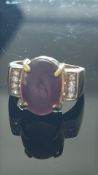 9ct Gold ring set with cabochon amethyst and diamo