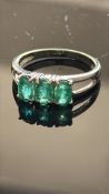 9ct White Gold ring set with emeralds Weight 2.6g