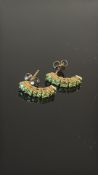 Pair of 9ct gold earring set with green gemstones
