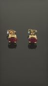 Pair of 9ct gold earring set with red stones