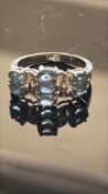 9ct White Gold ring set with blue topaz & diamonds