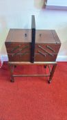Mid-Century wooden sewing box on castored stand