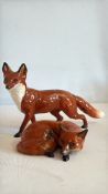 2 Beswick foxes 1 standing & 1 lying down