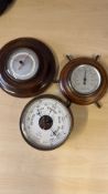 Group of three English mahogany-cased barometers a
