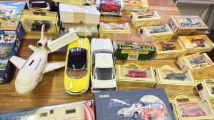 Collection of diecast vehicles and assorted toy mo