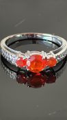 9ct White Gold ring set with orange/red stone Weig