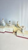 Set of four boxed Nao by Lladro porcelain figurine